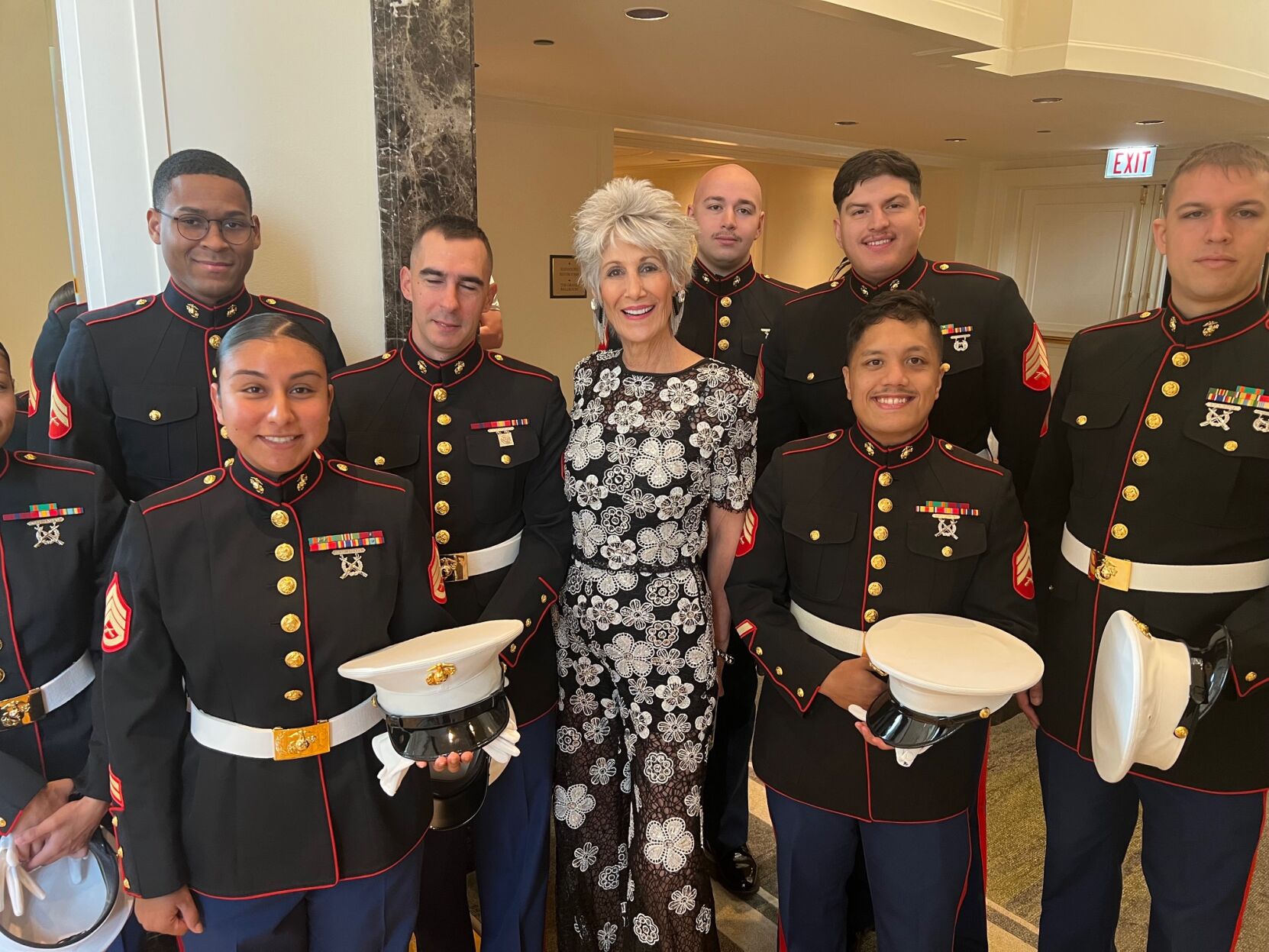 Cook County Treasurer Maria Pappas was a model in the show. Here she is shown surrounded by members of the U.S. Marines. (Photo by Candace Jordan)